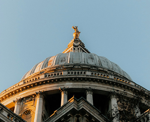 Golden justice statue on top of The Old Bailey building in Central London