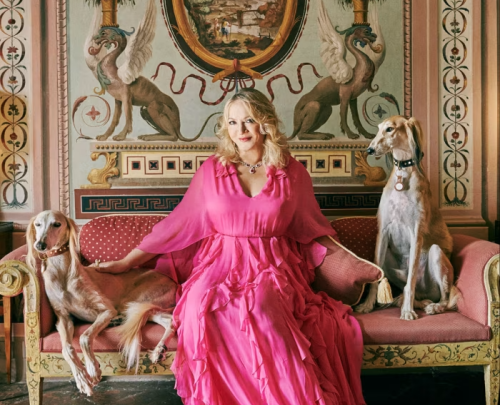 The statue of Justice atop the building of the Royal Courts of Justice, in front of a blue sky